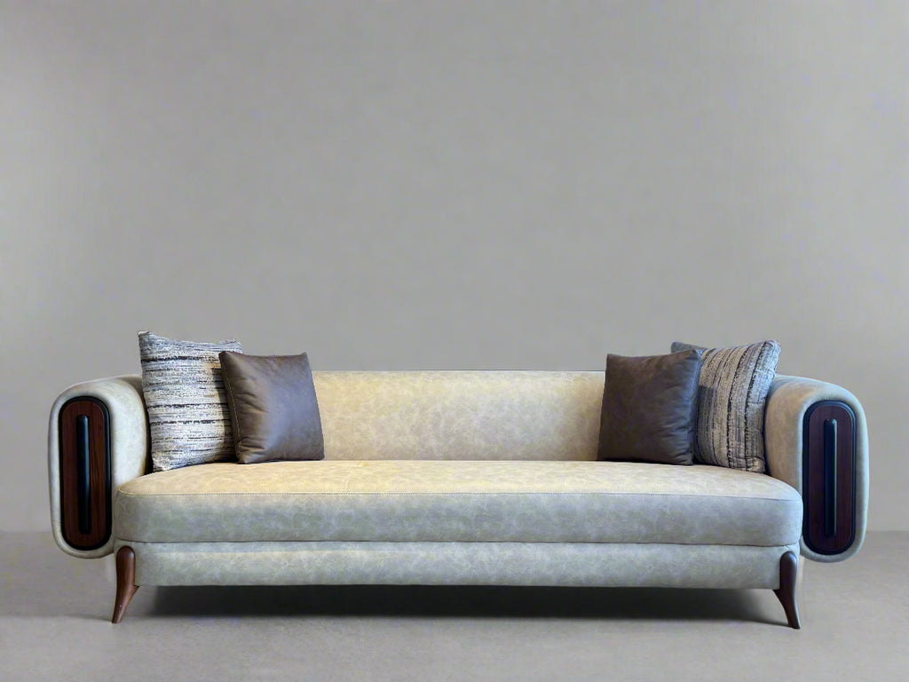 Beige sofa with decorative pillows in a modern interior setting
