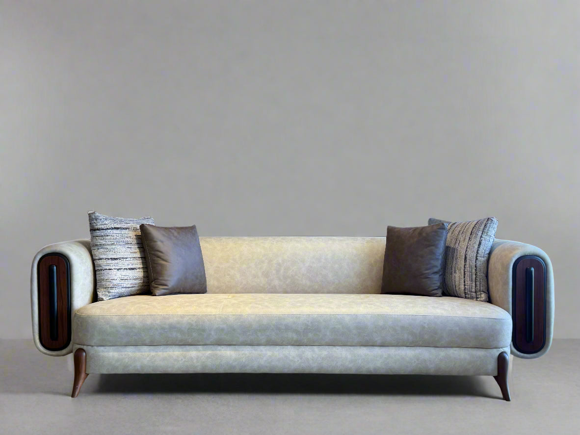 Beige sofa with decorative pillows in a modern interior setting